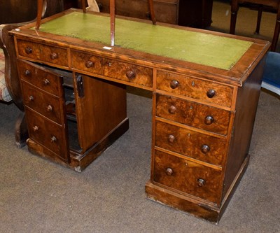 Lot 1229 - A late Victorian walnut veneered twin pedestal writing desk, 122cm by 53cm by 77cm