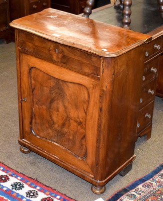 Lot 1235 - A late Victorian walnut veneered cupboard, the shaped top over a frieze drawer above a quarter...