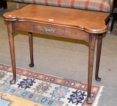 Lot 1238 - A18th century walnut fold-over card table, 91cm by 45cm by 71cm