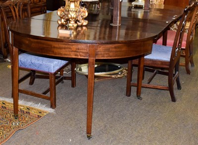 Lot 1258 - A George III inlaid mahogany D-end dining table with three additional leaves, 267cm by 127cm...