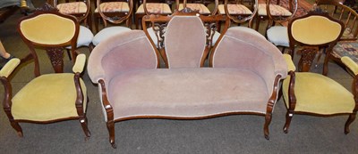 Lot 1259 - A late Victorian mahogany framed sofa together with a pair of similar open armchairs,...