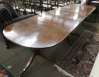 Lot 1262 - A Regency style triple pedestal dining table with three additional leaves, 328cm by 107cm open,...