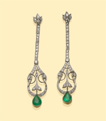 Lot 644 - A Pair of Diamond and Emerald Drop Earrings, a string of brilliant cut diamonds suspends a...