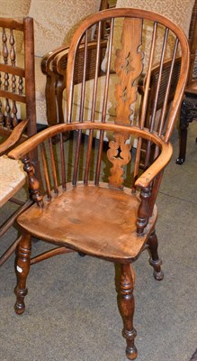 Lot 1264 - A late 19th century Windsor armchair, spindle back with a central splat