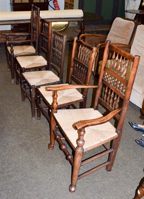 Lot 1265 - Five 19th century matched Lancashire spindle back rush seated kitchen chairs (5)