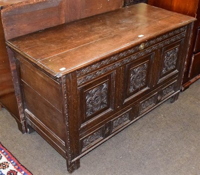 Lot 1283 - An 18th century carved oak mule chest with internal candle box on a two drawer base, 133cm by...
