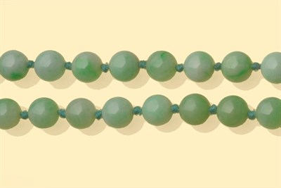 Lot 646 - A Jadeite Bead Necklace, spherical beads knotted as one strand, length 115cm