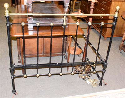 Lot 1286 - A black painted iron and brass double bed frame, 198cm by 126cm, 127cm high