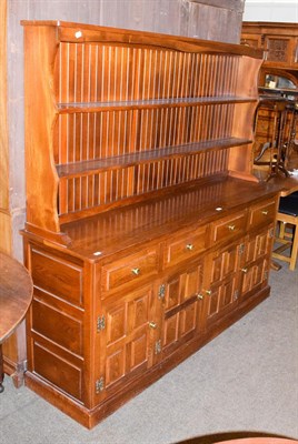 Lot 1297 - A 20th century elm dresser and rack made by Cryercraft of Bishop Thornton, circa 1980, 183cm by...