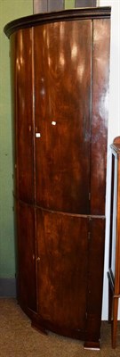 Lot 1303 - A George III mahogany bow fronted standing corner cupboard with dentil moulded cornice, 100cm...