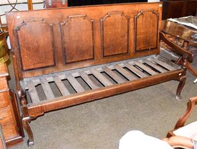 Lot 1315 - An 18th century oak and mahogany crossbanded four panelled settle, 186cm by 62cm by 111cm