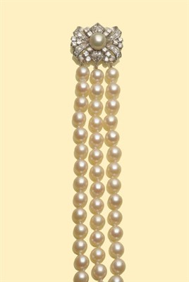 Lot 649 - A Cultured Pearl Bracelet with Diamond Clasp, the three row bracelet of 20:19:20 knotted strung...