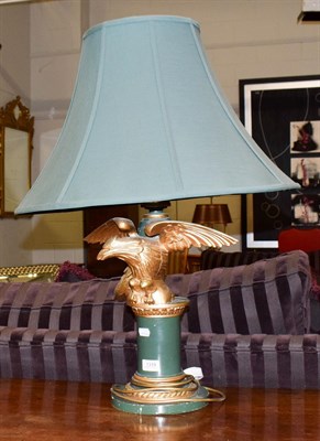 Lot 1319 - A Regency style eagle form gilt and green painted table lamp with green shade, 74cm including shade