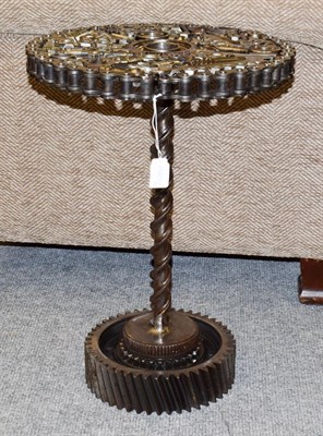 Lot 1321 - a Steampunk Industrial metal tripod table, constructed using various industrial sprockets,...