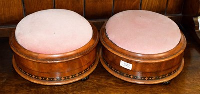 Lot 1322 - A pair of 19th century inlaid mahogany footstools, the circular hinged covers opening to reveal...