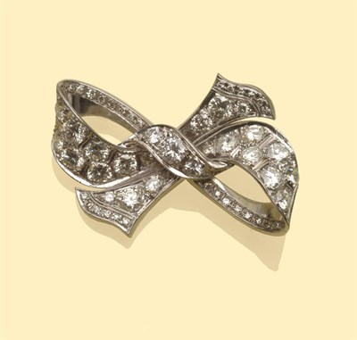 Lot 650 - A Diamond Bow Brooch, the round brilliant cut diamonds in white claw settings, to a milled edge...