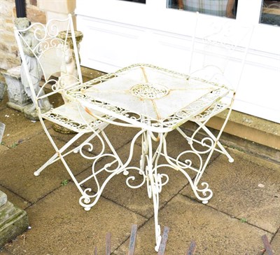 Lot 1333 - A white painted metal garden table 60cm square by 71cm high and two matching folding chairs