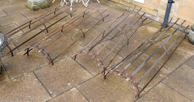 Lot 1340 - A pair of wrought metal tree guards, each in two sections 200cm high (4)