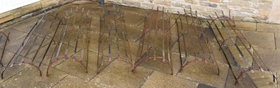 Lot 1342 - Three wrought metal tree guards, each in two sections 200cm high (6)