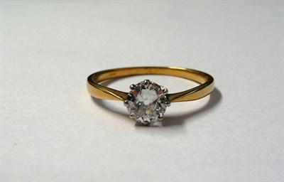 Lot 658 - A Diamond Solitaire Ring, the old cut diamond in a white eight claw setting, to a yellow...