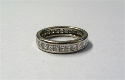 Lot 661 - A Diamond Eternity Ring, princess cut diamonds in white channel settings, total diamond weight 1.75