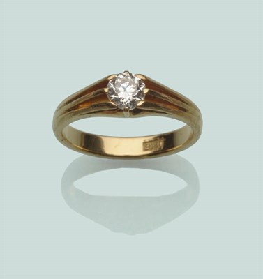 Lot 665 - A Diamond Solitaire Ring, the old brilliant cut diamond in a yellow claw setting on tramline...