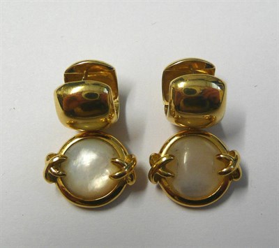 Lot 678 - A Pair of Mother-of-Pearl Earrings, a cuff style form suspends a cabochon mother-of-pearl, in a...