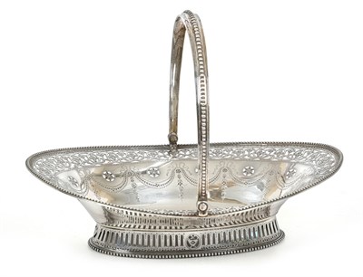 Lot 2192 - A George III Silver Basket, by William Plummer, London, 1783, oval and on spreading pierced...