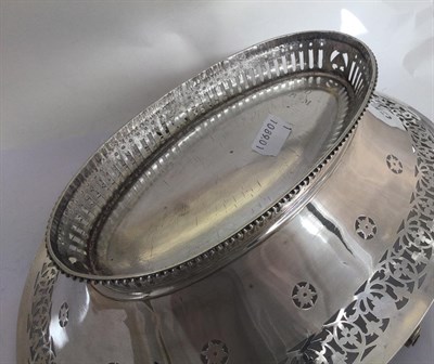 Lot 2192 - A George III Silver Basket, by William Plummer, London, 1783, oval and on spreading pierced...