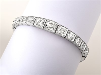 Lot 2096 - An Art Deco Diamond Bracelet, circa 1925, thirteen graduated old cut diamonds, in white...