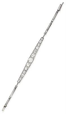 Lot 2096 - An Art Deco Diamond Bracelet, circa 1925, thirteen graduated old cut diamonds, in white...