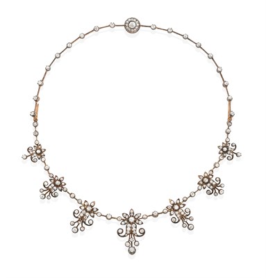 Lot 2116 - An Edwardian Diamond Necklace/Tiara, circa 1900, the front graduated with seven floral scrolled...