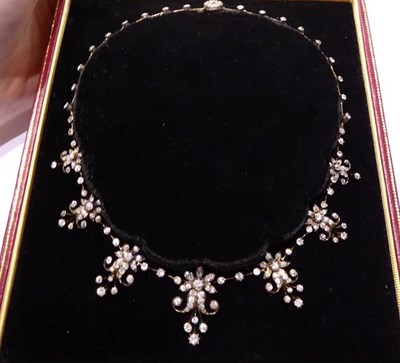 Lot 2116 - An Edwardian Diamond Necklace/Tiara, circa 1900, the front graduated with seven floral scrolled...