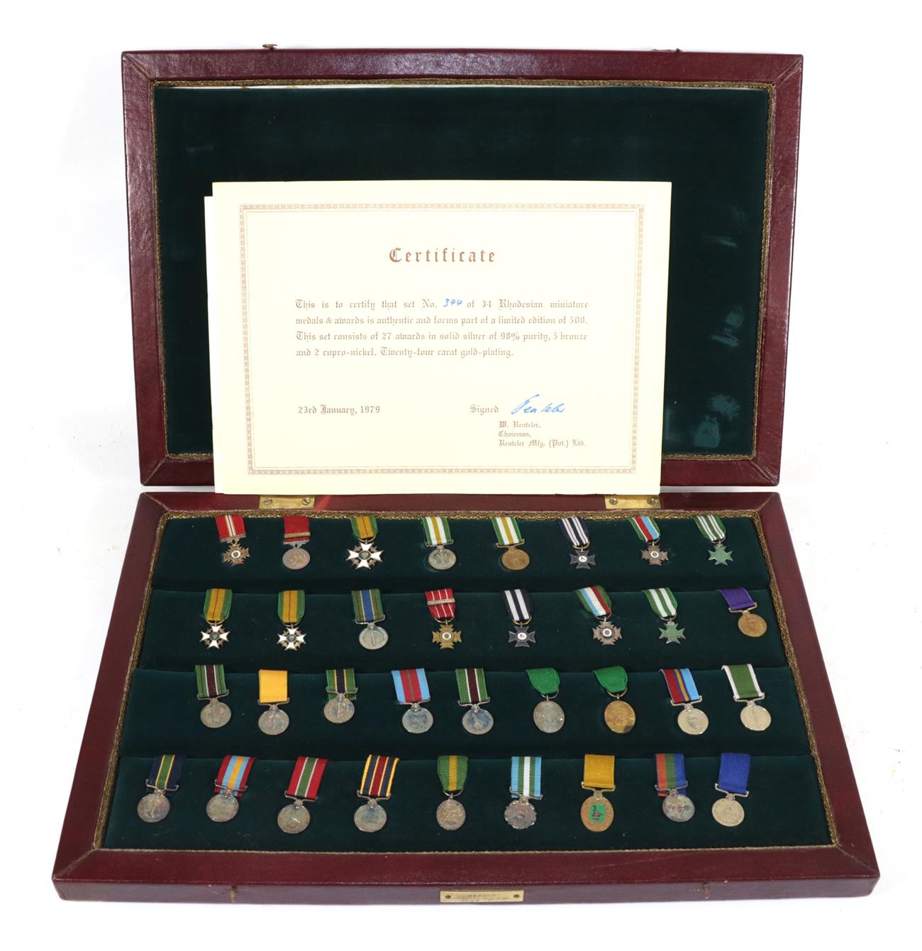 Lot 6 - A Commemorative Set of Thirty Four Rhodesian Miniature Medals and Awards, twenty seven in solid...