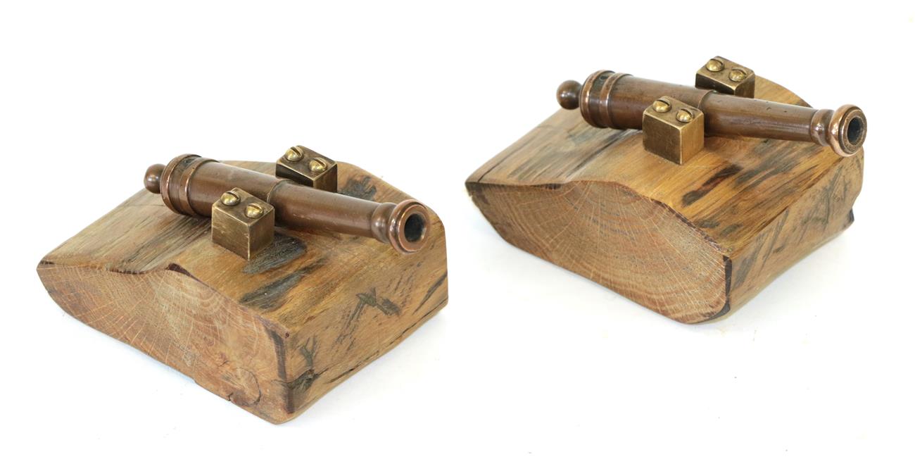 Lot 48 - A Pair of Small Bronze Desk Cannon, each with 11cm two stage barrel, mounted on an oak base