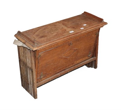 Lot 62 - An Early 20th Century Oak Campaign Bed, with a hinged rectangular top rising to form the...