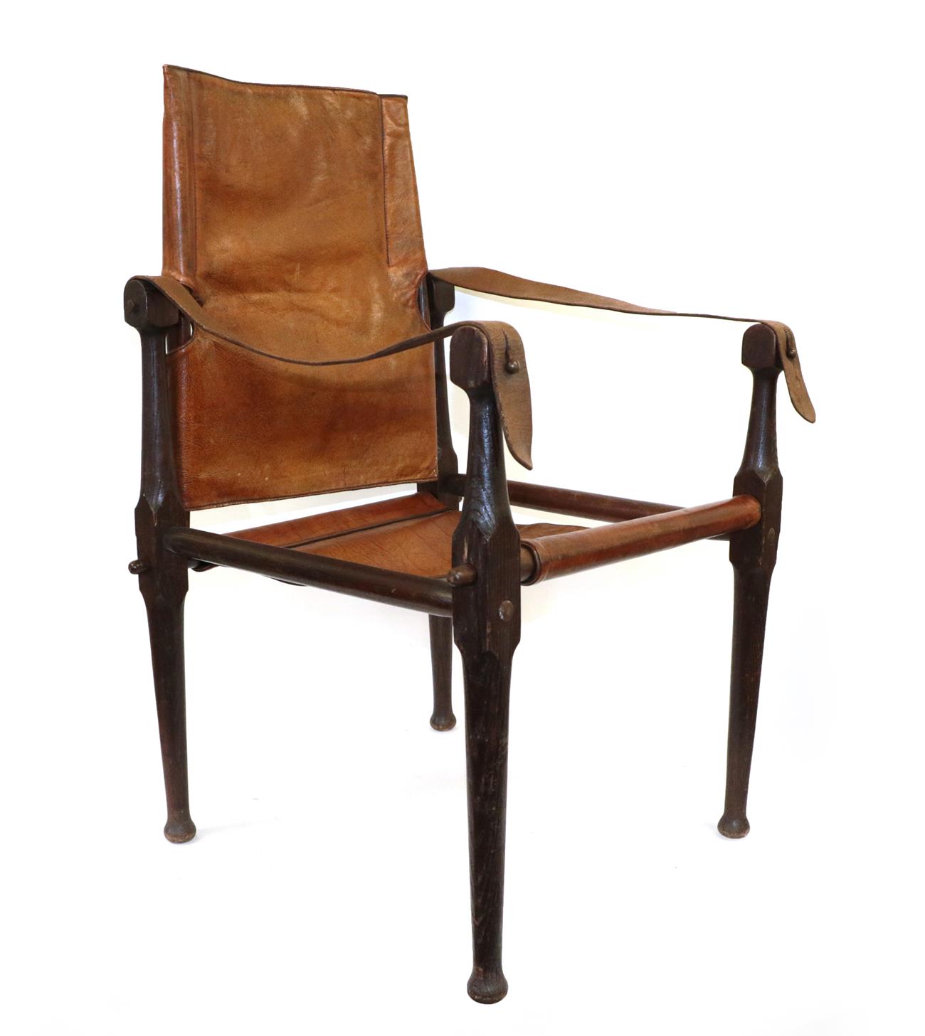 Lot 65 - An Early 20th Century ''Roorkhee'' Campaign Chair, the turned oak frame with conical terminals...