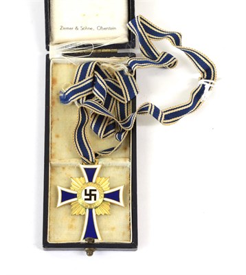 Lot 90 - A German Third Reich Mother's Cross in Gold, in blue leather cloth case, the interior marked Zimmer