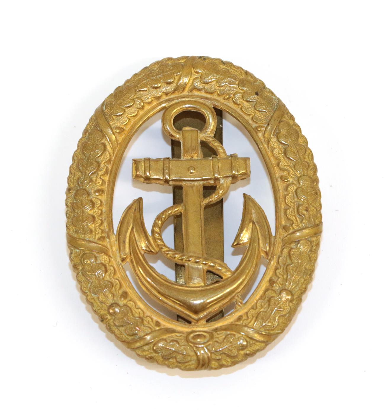 Lot 95 - A German Third Reich Kriegsmarine Officer of the Watch Badge, in stamped gilt metal, with...
