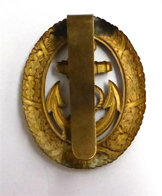Lot 95 - A German Third Reich Kriegsmarine Officer of the Watch Badge, in stamped gilt metal, with...