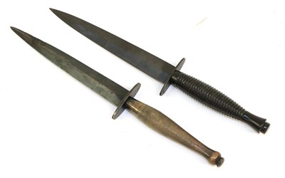 Lot 128 - A Wilkinson's Fairbairn Sykes Second Pattern Fighting Knife, with 17cm hand forged blackened...