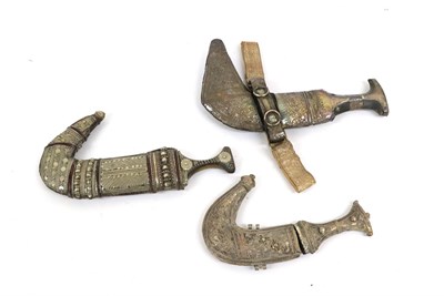 Lot 145 - Two Arab Jambiyas, each with double edge curved steel blade with raised medial ridge, horn grip...