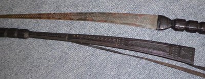 Lot 151 - A Tuareg Type Sword, with diaper engraved steel blade, leather bound grip and scabbard; two...
