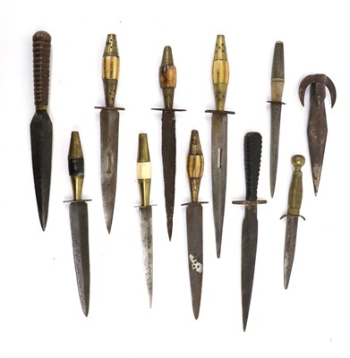 Lot 154 - Six North African Daggers, each with double edge steel blade and brass ovoid grip with...
