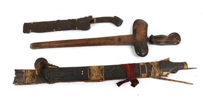 Lot 157 - A Malayan Kris, with 39cm four lok pamor steel blade, cabouchon coloured glass set mendak, wood...
