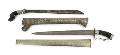 Lot 158 - An Indonesian Penai, the 37cm single edge steel blade slightly broader and squared off at the...