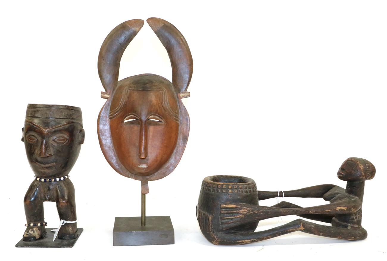 Lot 172 - A Yaure Wood Mask, Ivory Coast, with flat inward curving horns, small ears, oval face with...