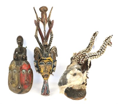 Lot 179 - A Yaure Portrait Mask, Ivory Coast, with two pairs of horns centred by a bird headdress, painted in