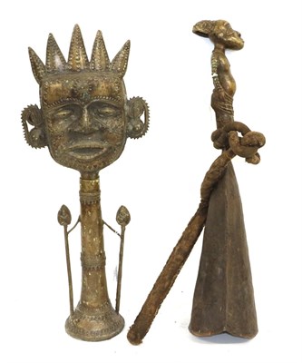 Lot 180 - A Yoruba Large Figural Bell, the handle cast in bronzed as a tribesman, the bell of overlapped...
