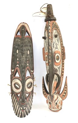 Lot 183 - A Papua New Guinea Wood Gable Mask, carved as an elongated stylised boar's head with two pairs...